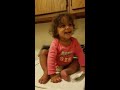 Really cute baby girl on washing machine