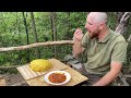 The simple and happy life of a mountain man, surrounded by pets. Cooking traditional.