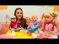 Baby doll chooses new clothes for Baby Born doll twins