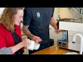 Teaching a beginner how to pour latte art patterns