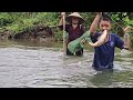 Orphan boy Thanh and his grandmother trap stream fish in the heavy rain and catch a big fish to sell