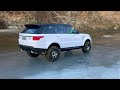 Range rover driving on ice in winter
