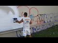 Using the Graco Ultra cordless handheld sprayer to cover over graffiti.