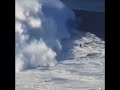 Man surfing tsunami