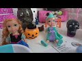 Elsa and Anna toddlers play with Halloween slime