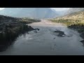 Debris floating down the Fraser River in Lillooet at the Old Bridge