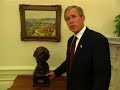 George W. Bush stumbles through tour of the Oval Office