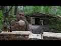 woodworking in dugout at heavy rain , making kuksa , no talking