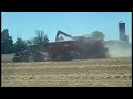 Red equipment harvests barley 2022