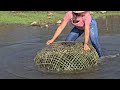 The girl creates a bamboo trap to catch giant fish in a stuffy lake