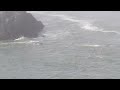 Oregon Coast line and a whale in the surf. Oct., 10 - 2016