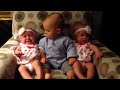 Adorably confused baby meets twins