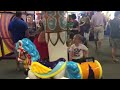 Colby & Lexie riding Chuck E. Cheese merry go round 6-25-26