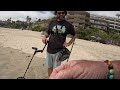 Metal Detecting on the Beach.
