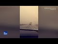 Wind Storm turns over a truck in traffic.