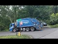 Republic Services Mack LEU Mcneilus rear loader on residential recycling route.