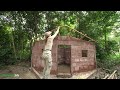 Building Complete Survival Brick Bushcraft shelter with wooden roof in Wilderness
