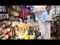 Walking in Dubai Afghani Shopkeeper selling Coral Bead stones Pearls Crystal Silver Jewlery Bracelet