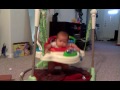 Skyler playing on jumperoo