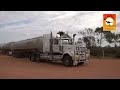 Massive road trains at roadhouses in outback Australia