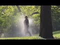 Woman Taking Sprinkler Bath In Central Park