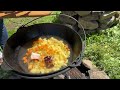 Life in a mountain village: Green borsch in a cauldron and bread 