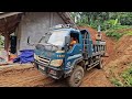 excavator, car the finishing carrying land landslide Entering the farmer's house.