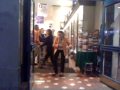 Crazy lady dancing tango in a bookstore.