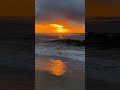 Cloudy morning beach sunrise with relaxing sounds of waves