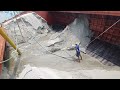 Relaxing sound and cool video with drager machine unloading sand on big barge ship river side