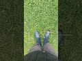 Walking across a wet field in Blue Border Wellies