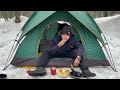 Solo camping in a remote snowy forest with cozy nature sounds