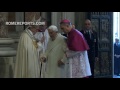 Pope Emeritus Benedict XVI walks through the Holy Door