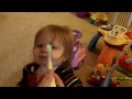 Amelia getting teeth brushed, age 13½ months