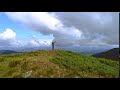 male with a color smoke bomb standing on the beautiful mountain hua