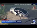 FULL CHASE: Robbery suspect emerges from car with baby after wild LA pursuit