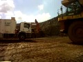 Carregamento Caterpillar 775G com Hitachi EX 1200