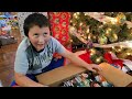 WE CAUGHT SANTA BRINGING THE BEST CHRISTMAS PRESENTS! ARI AND ETHANS FAVORITE MYSTERY SUPRISE GIFTS!