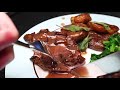 Roast goose with Christmas spices, black cherry gravy, goose-fat roast potatoes and mustard greens