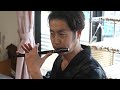 The process of making a traditional Japanese flute Shinobue. Japanese flute craftsman.
