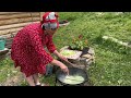 Rural life high in the mountains: cooking cabbage rolls with rice in a cauldron, peppermint tea