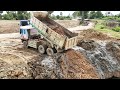 Unusually High Pouring The Land Into Deeply Water Pond By KOMATSU DOZER D60p Operated Dump Truck