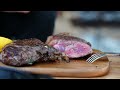 Watch as a giant sirloin is grilled to perfection in camp by the chef