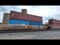 Canadian National Trains in Royal Oak, MI and People Crossing the Tracks in Front of the Train.