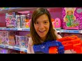 NERF BATTLE IN THE TOY STORE !!