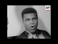 An ungleeful looking Cassius Clay -- 