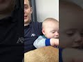 Dad Puts Baby to Sleep by Sliding Hand on Face - 1021454