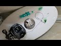 Retrieve toothbrush from toilet using fishing rig.