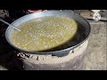 The process of cooking food in large pots in Uzbek