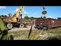 Loading rail cars with scrap & loaded FEC intermodal freight train headed south